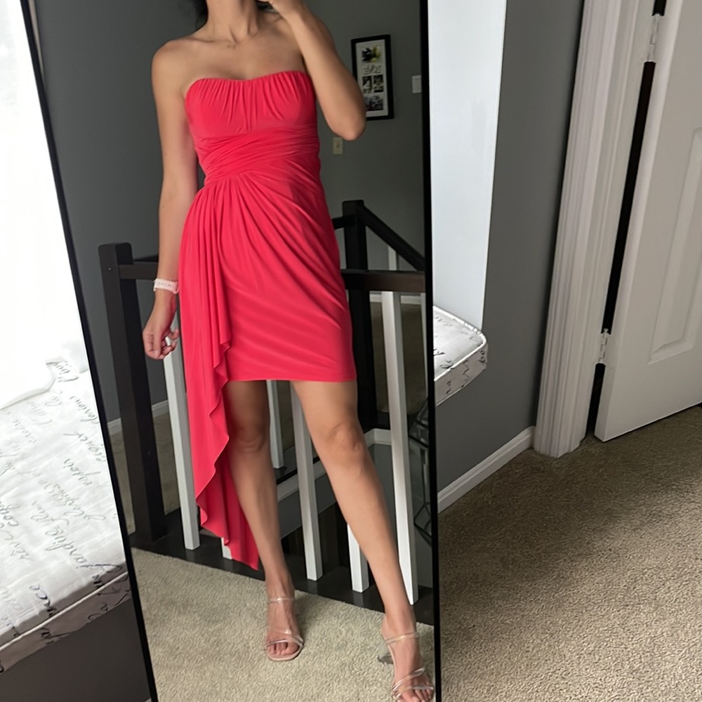 In new condition red dress. Very sexy and elegant